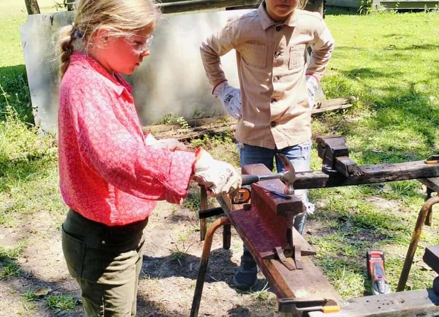 Children doing hands-on practical learning with tools
